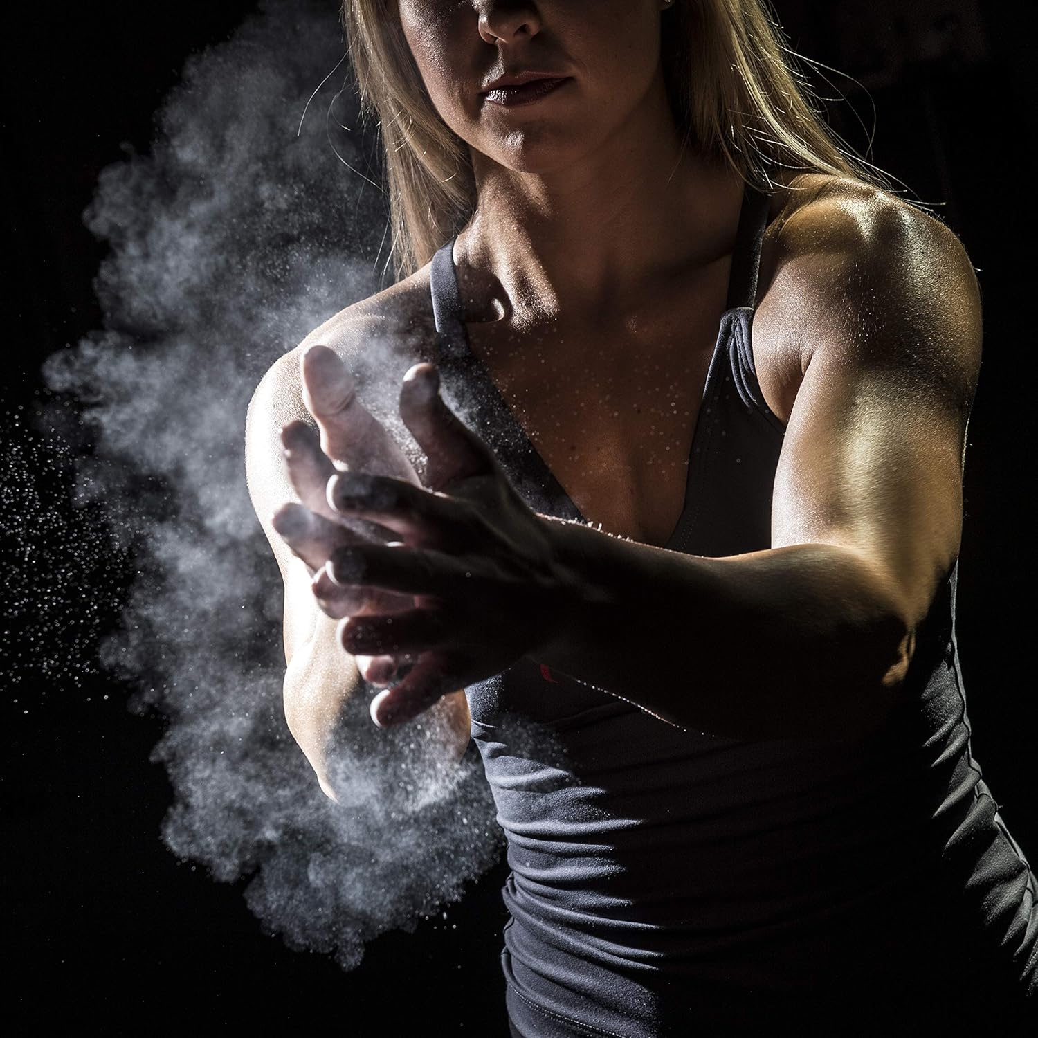 Athlete applying ProsourceFit gym chalk before lifting, highlighting enhanced grip and reduced moisture
