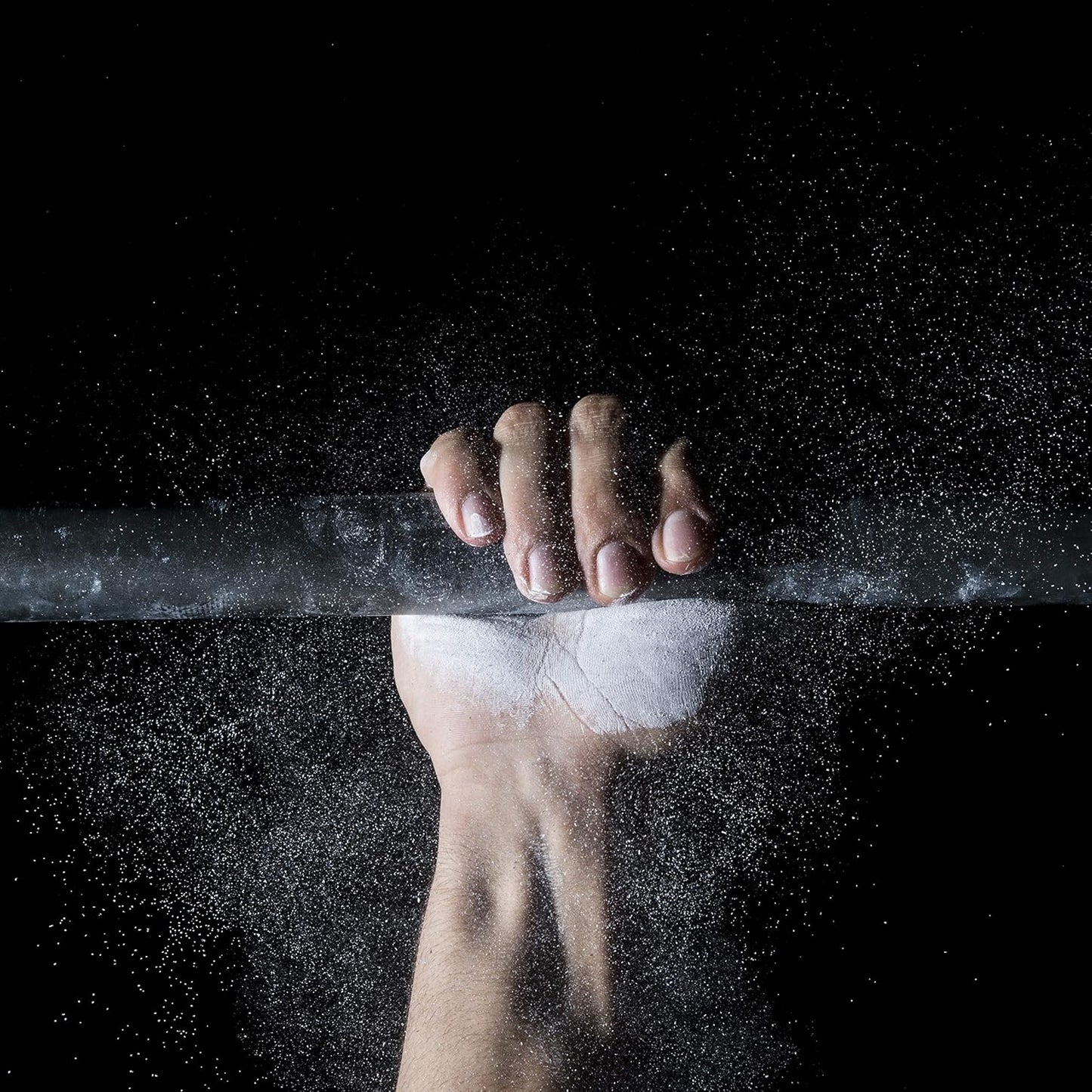 Athlete applying ProsourceFit gym chalk to hands before weightlifting workout for improved grip and performance