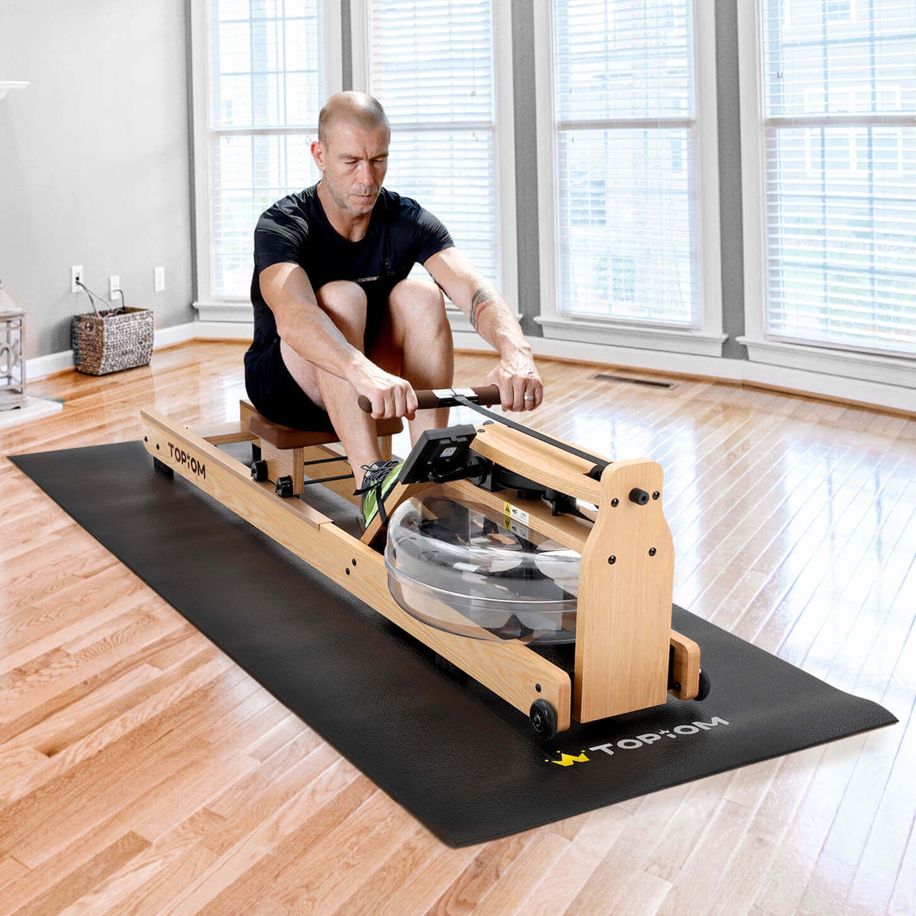 Person using rowing machine on Topiom non-slip fitness mat in home gym