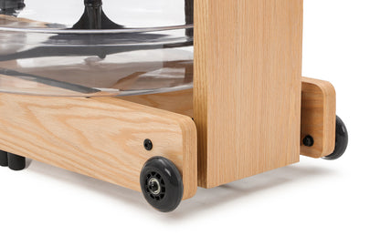 Closeup of easy transport wheels of the Topiom Natural wooden water rowing machine.