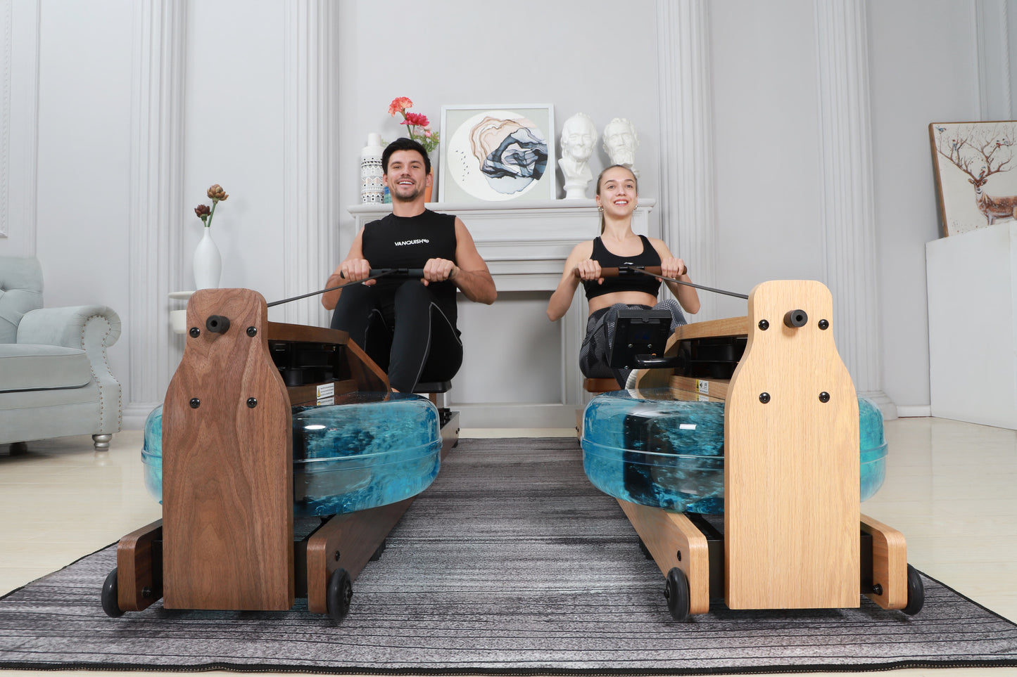 A couple using their Topiom walnut wooden water rowing machines in their home