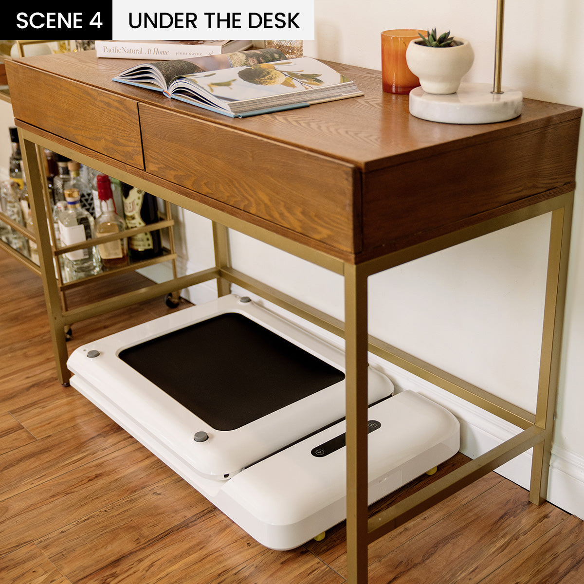 Compact WalkingPad C2 folded under a standing desk
