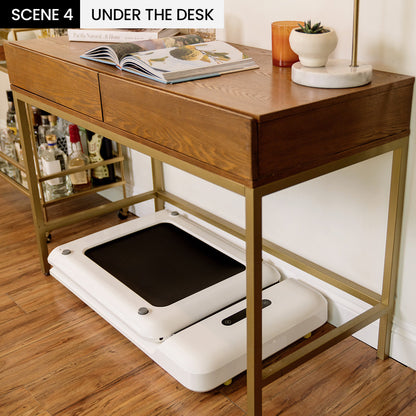 Compact WalkingPad C2 folded under a standing desk