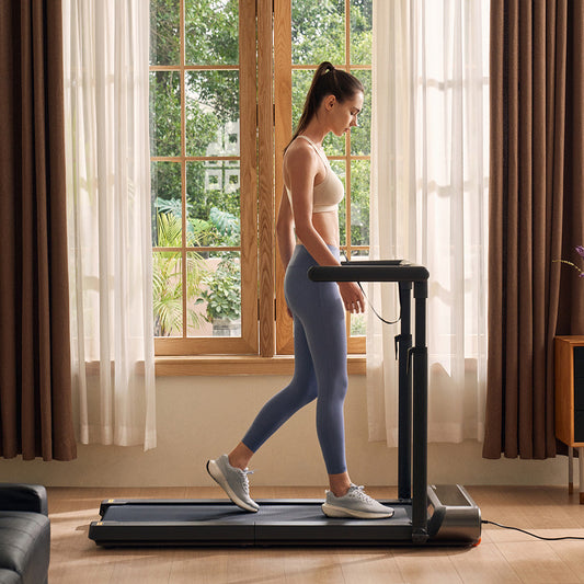 Compact WalkingPad R3 Hybrid treadmill placed being used in a home