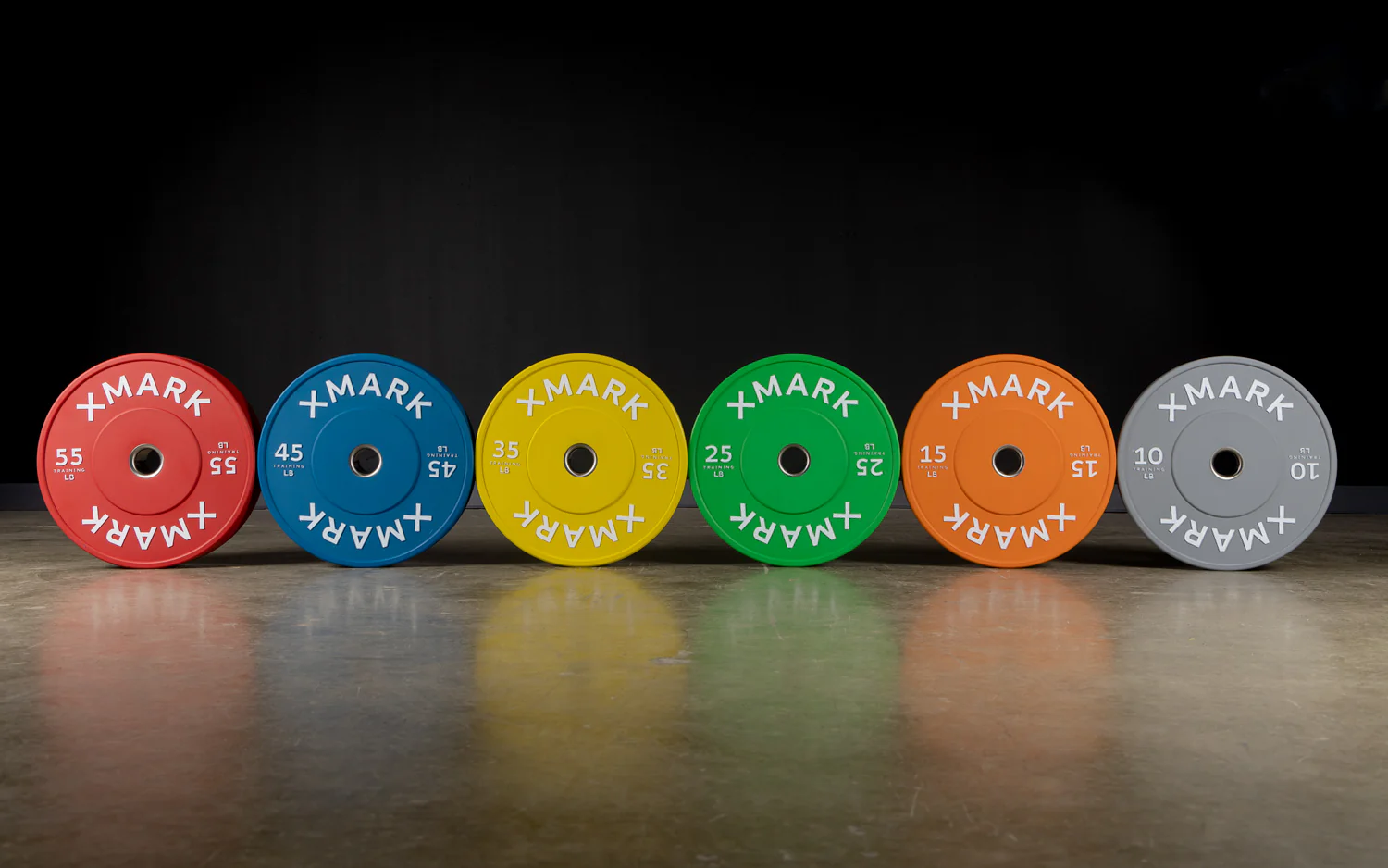 Color-coded Olympic bumper plates in all weight options