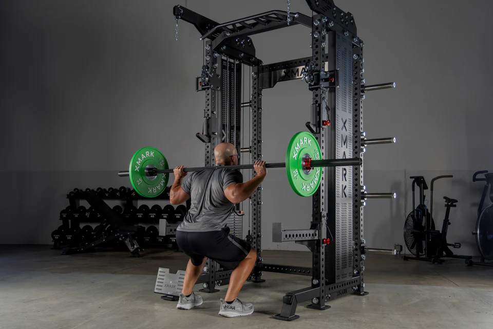 XMark commercial hybrid trainer fully assembled in a professional gym setting