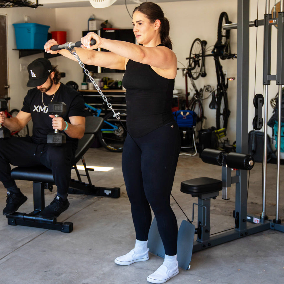 XMark Lat Pull‑Down Machine installed in home gym setting