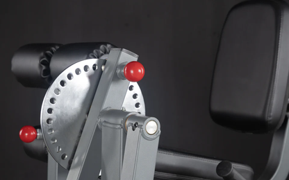 Close-up of adjustment mechanism for the XMark Rotary Leg Extension and Curl Machine