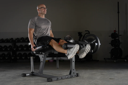 User performing leg extension with the XMark Machine