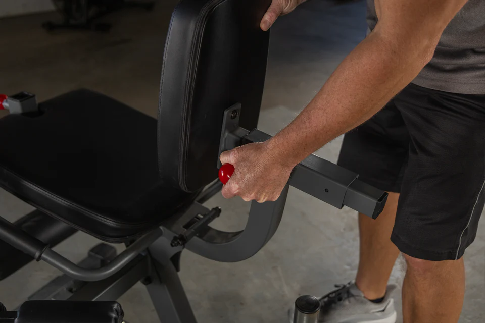 Adjustment mechanism for seat for the XMark Rotary Leg Extension and Curl Machine